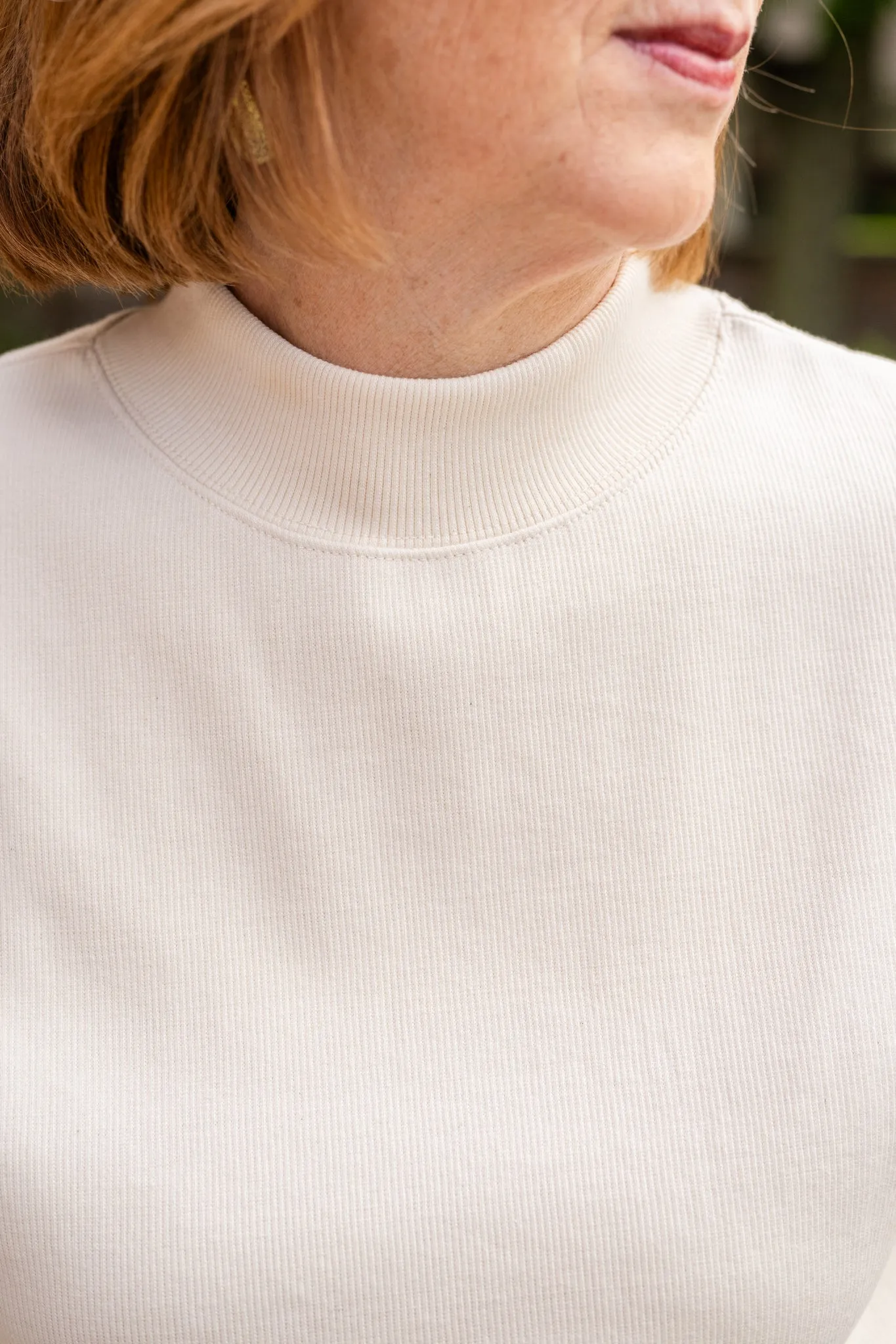 Sleeveless Tapered Mock Neck